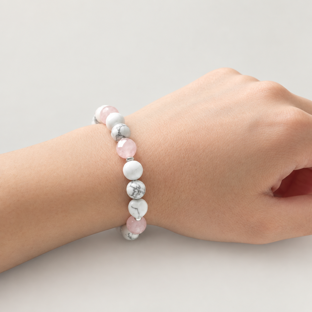 Rose quartz and howlite bracelet on a relaxed wrist
