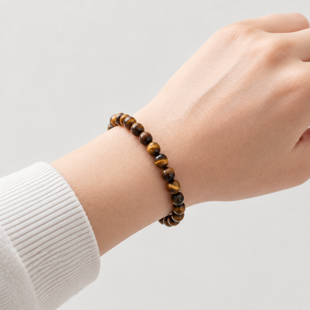4 mm tiger’s eye bracelet on a relaxed wrist, without a pointing finger
