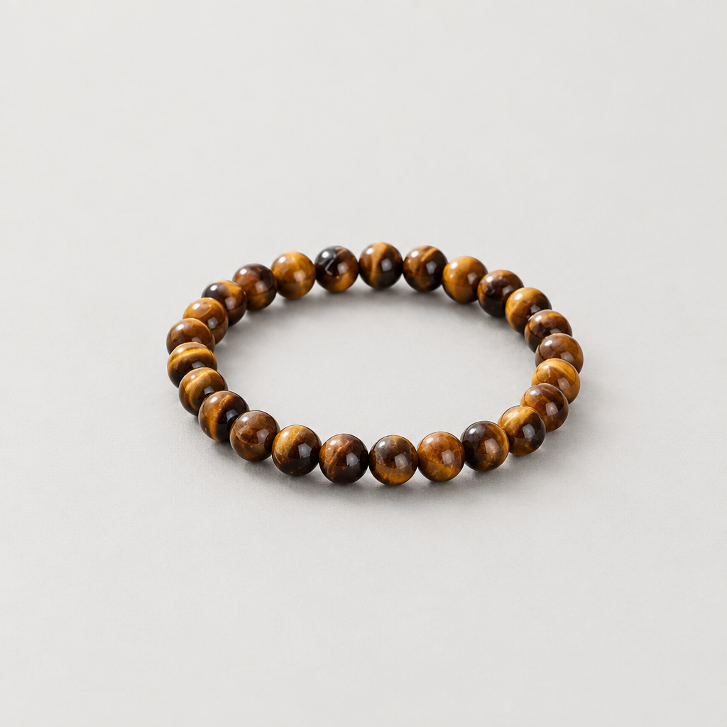 6 mm tiger’s eye bracelet on a light warm-grey background