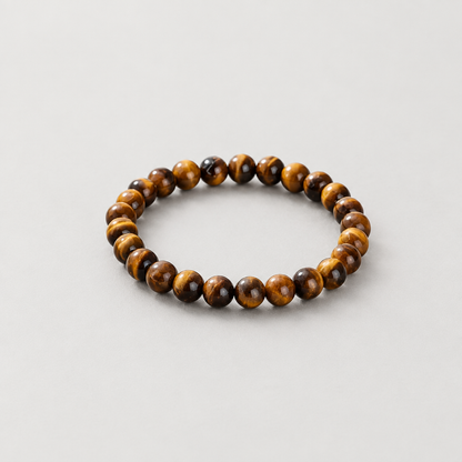 6 mm tiger’s eye bracelet on a light warm-grey background