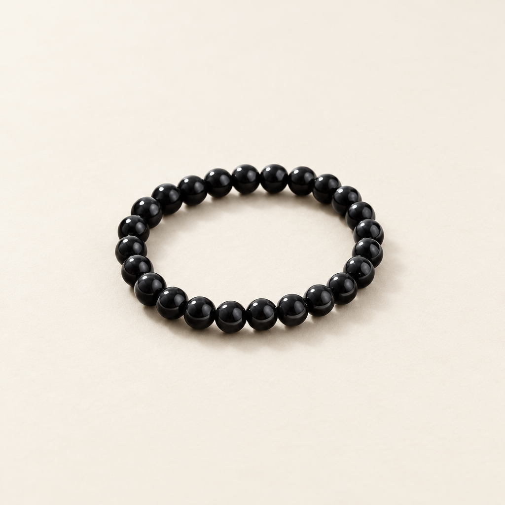 Obsidian bracelet with a clean ivory background