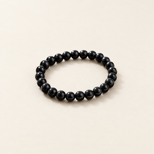 Obsidian bracelet with a clean ivory background
