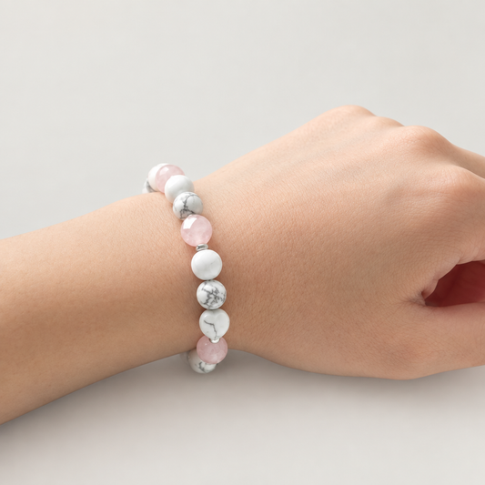 Rose quartz and howlite bracelet on a relaxed wrist
